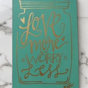 “Love More Worry Less” wooden sign